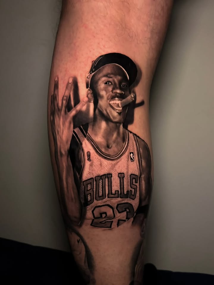 Black and grey realistic Michael Jordan Bulls portrait tattoo