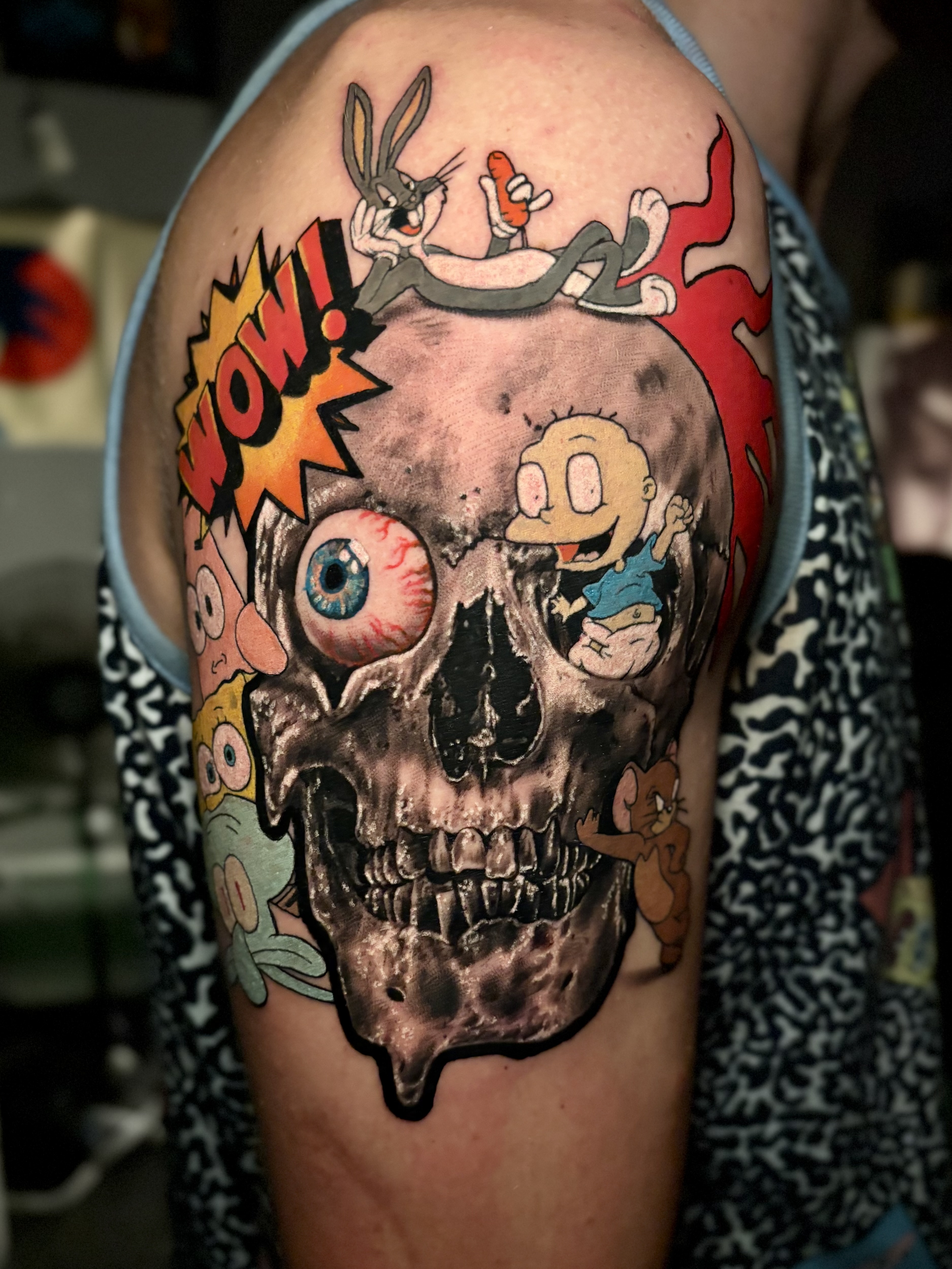 Cartoon skull mashup with Bugs Bunny and classic characters tattoo