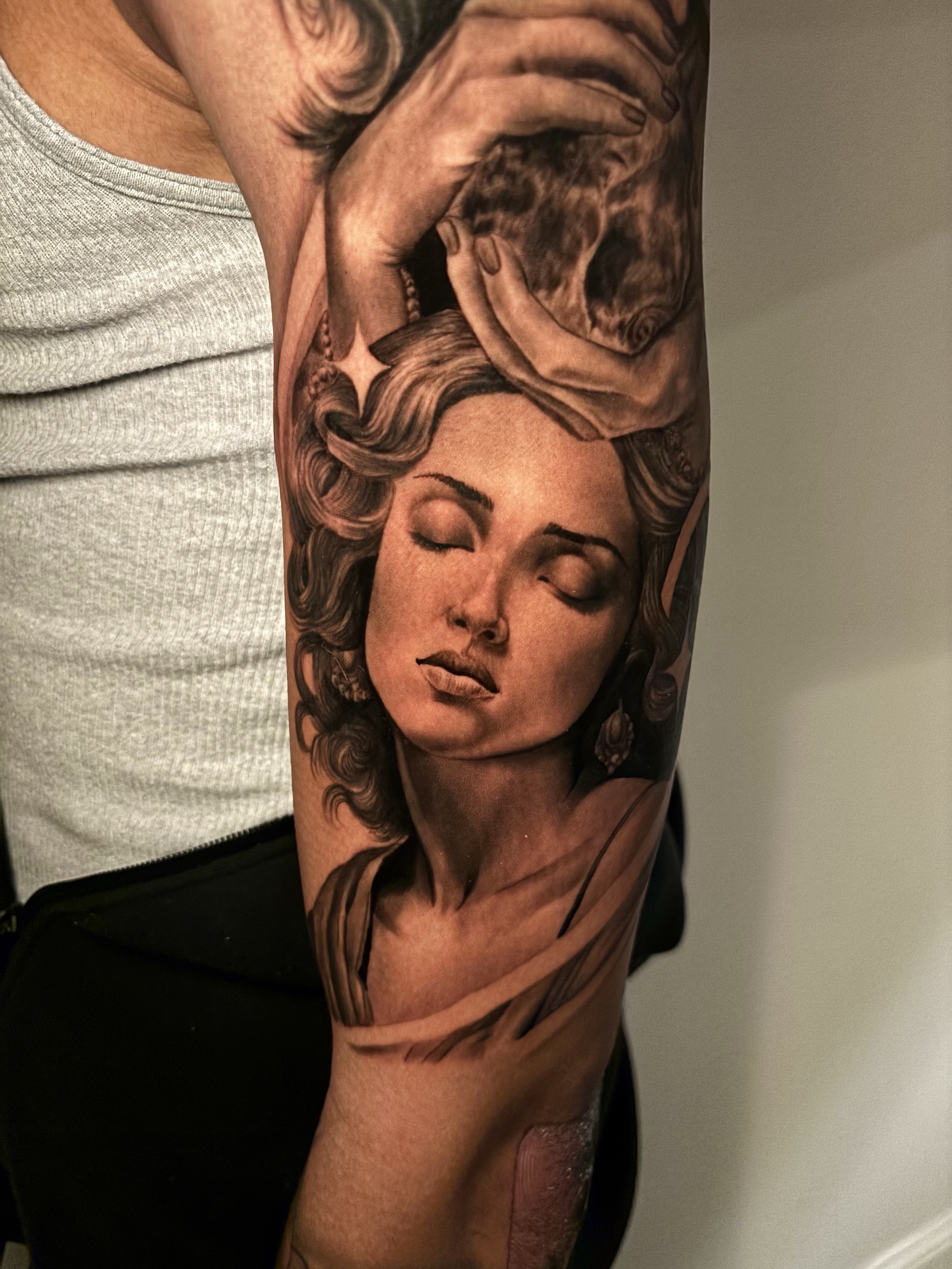 Realistic Marilyn Monroe portrait tattoo