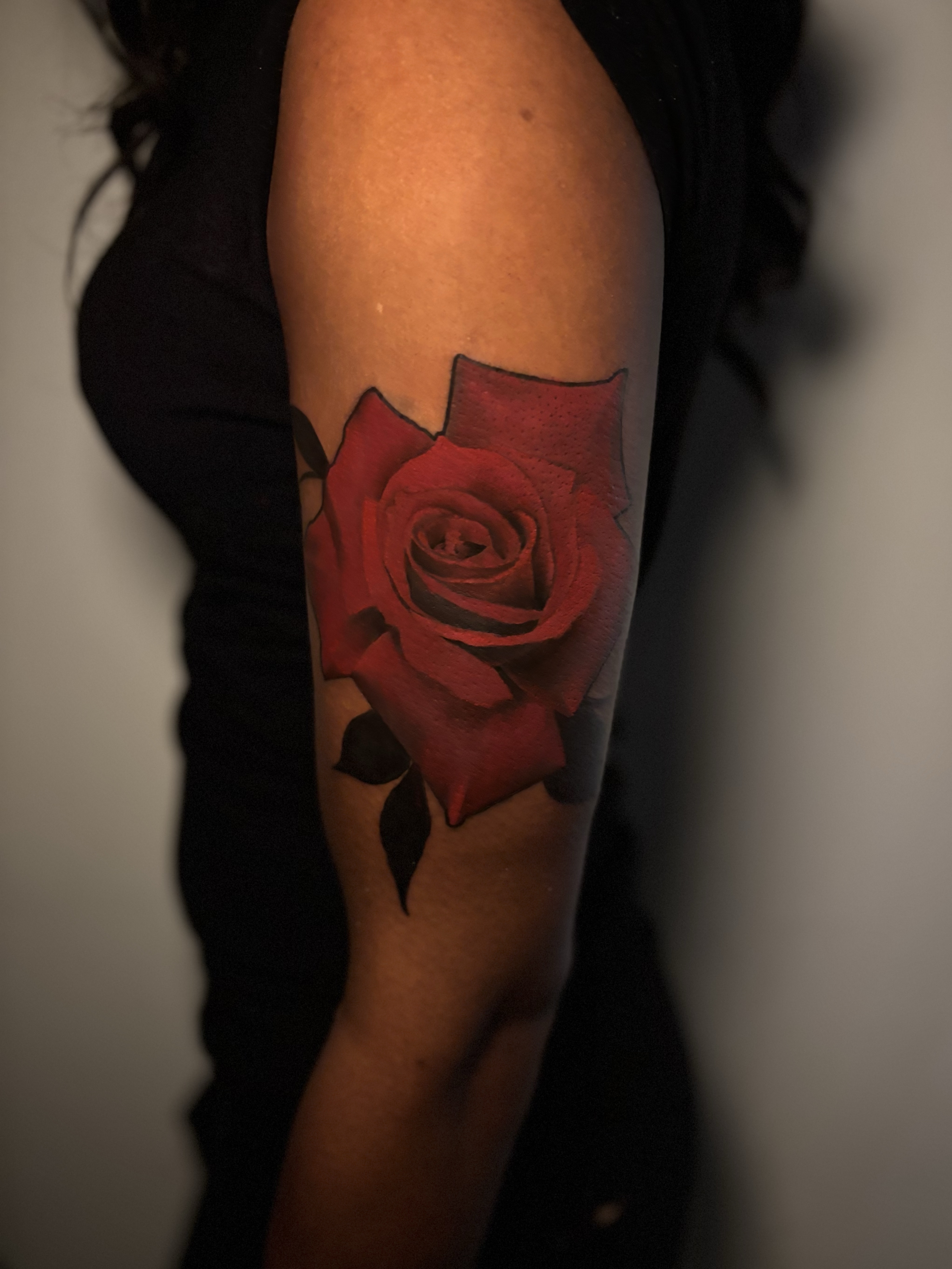 Bold red rose color tattoo