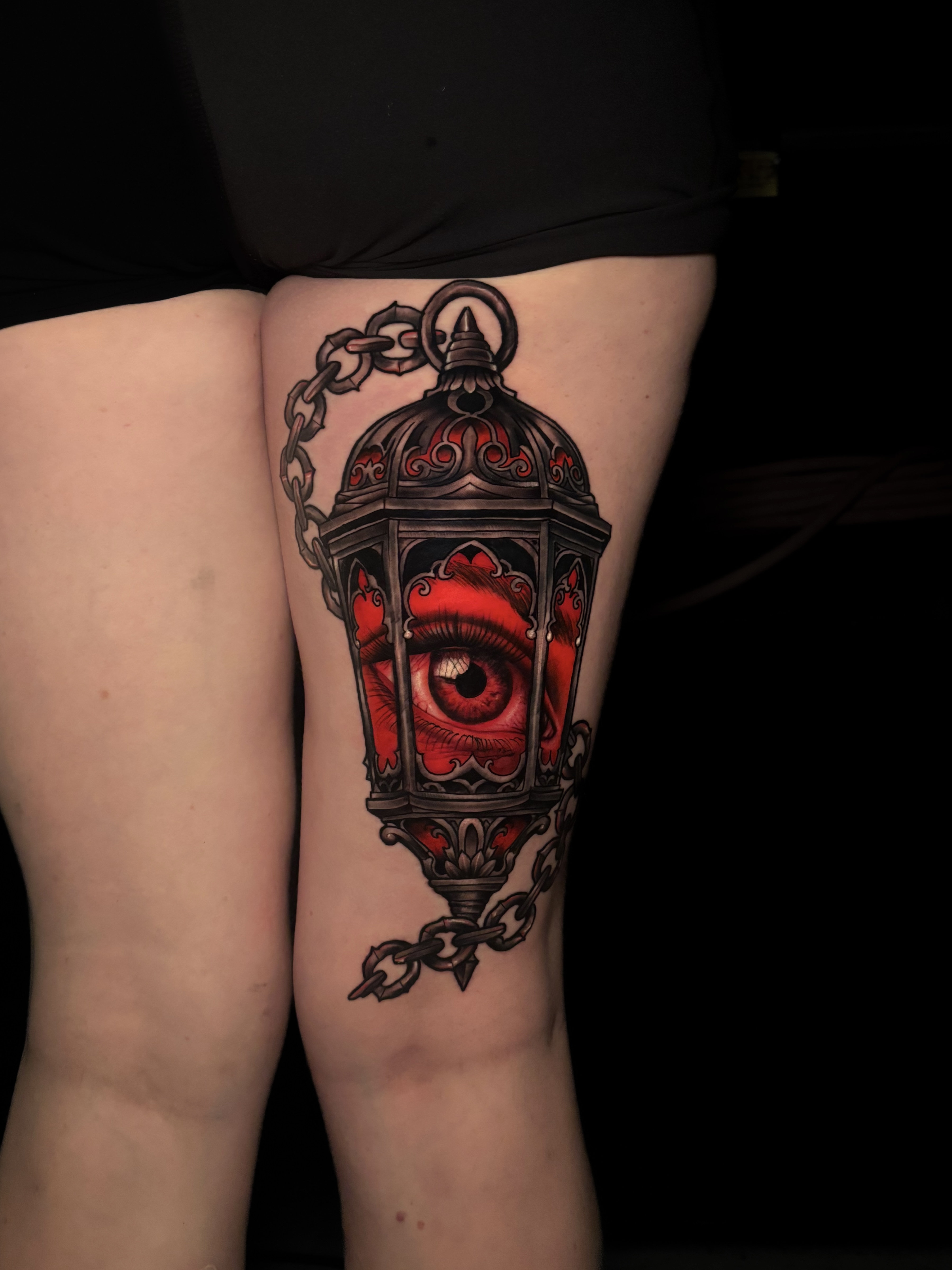 Lantern with realistic eye and chains tattoo
