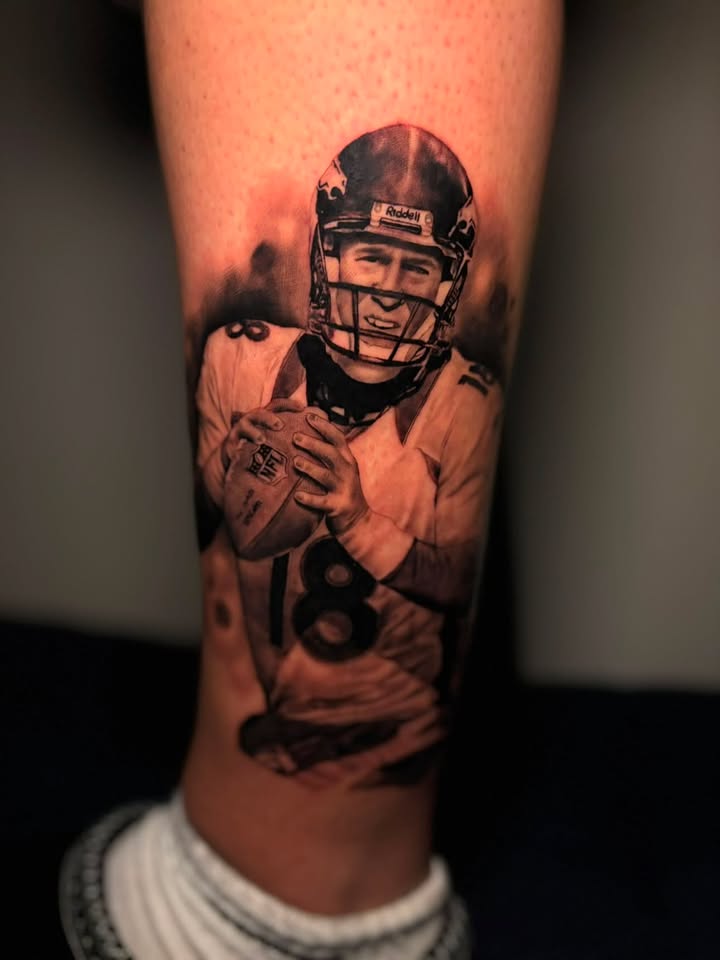 Black and grey realistic Peyton Manning Broncos portrait tattoo